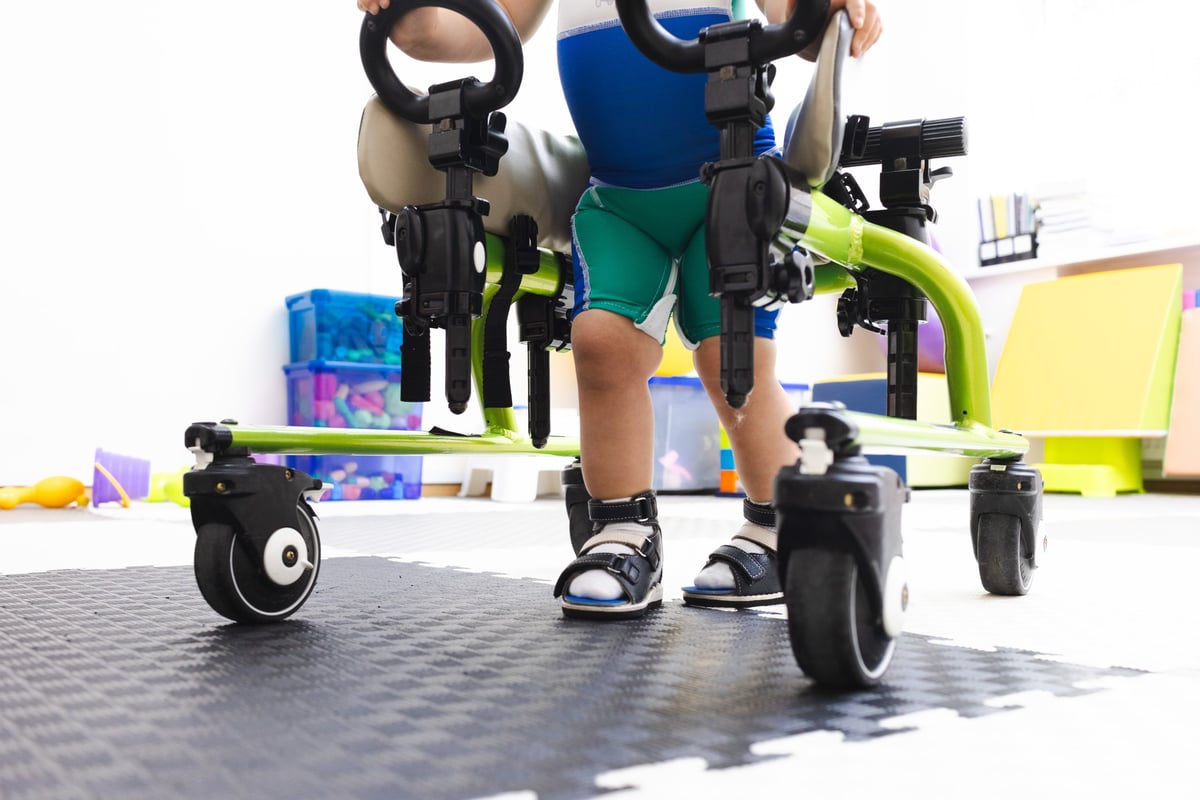 Walker for rehabilitation and restoration of walking of child in rehabilitation center